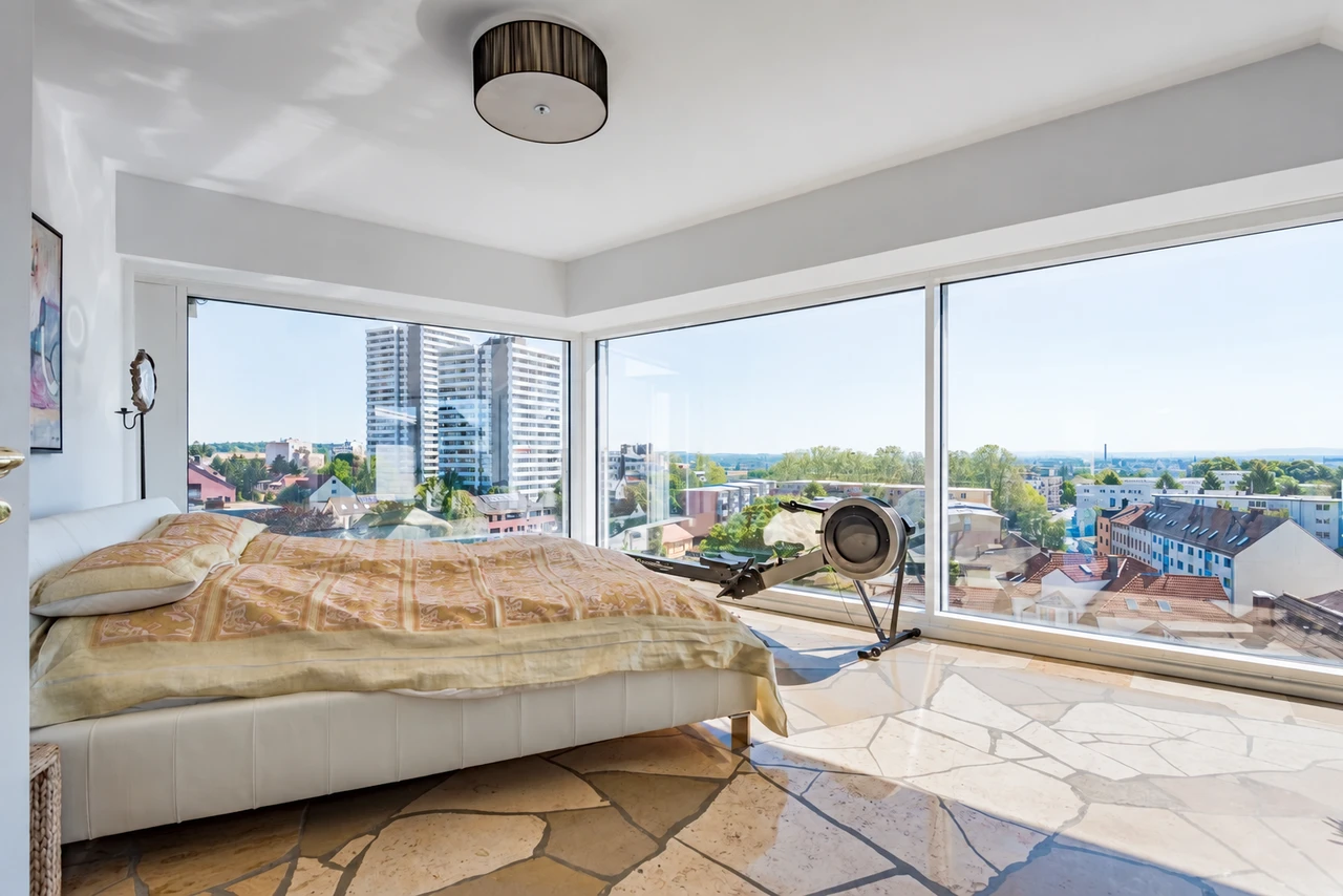 A bedroom with panoramic views